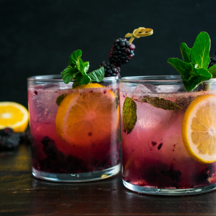 Rocks glass w/ berry lemonade cocktail